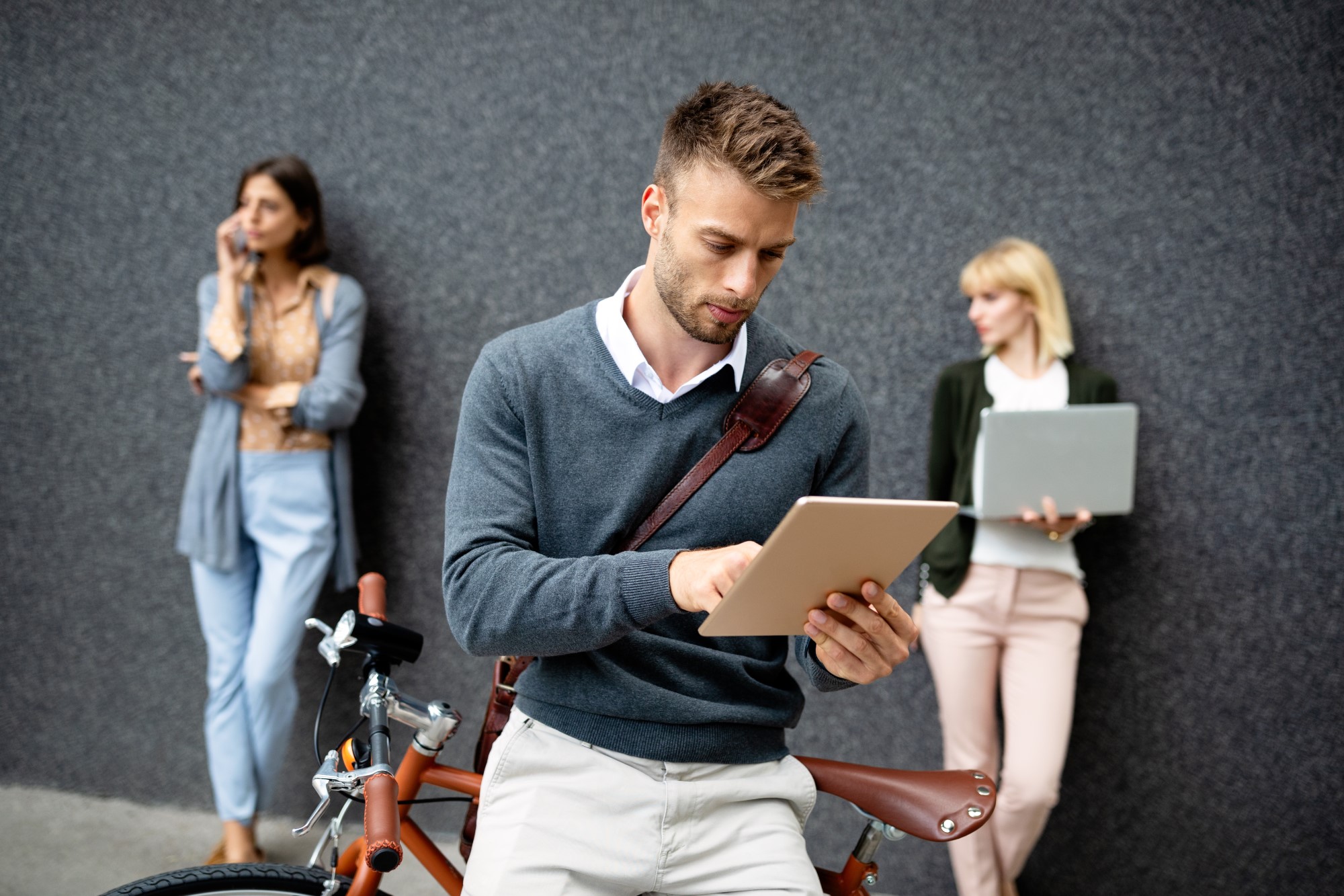 group-of-happy-young-business-people-holding-diffe-5Q6MVMN